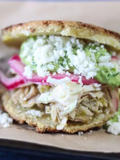 Arepas with Chile Verde Chicken & Guasacaca (Avocado Salsa) | A #lowcarb & #keto version of Arepas filled with Chile verde chicken, Avocado Sauce and slaw. | mincerepublic.com