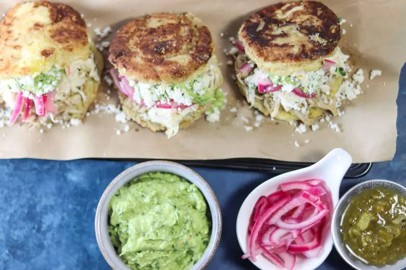 Arepas with Chile Verde Chicken & Guasacaca (Avocado Salsa) | A #lowcarb & #keto version of Arepas filled with Chile verde chicken, Avocado Sauce and slaw. | mincerepublic.com